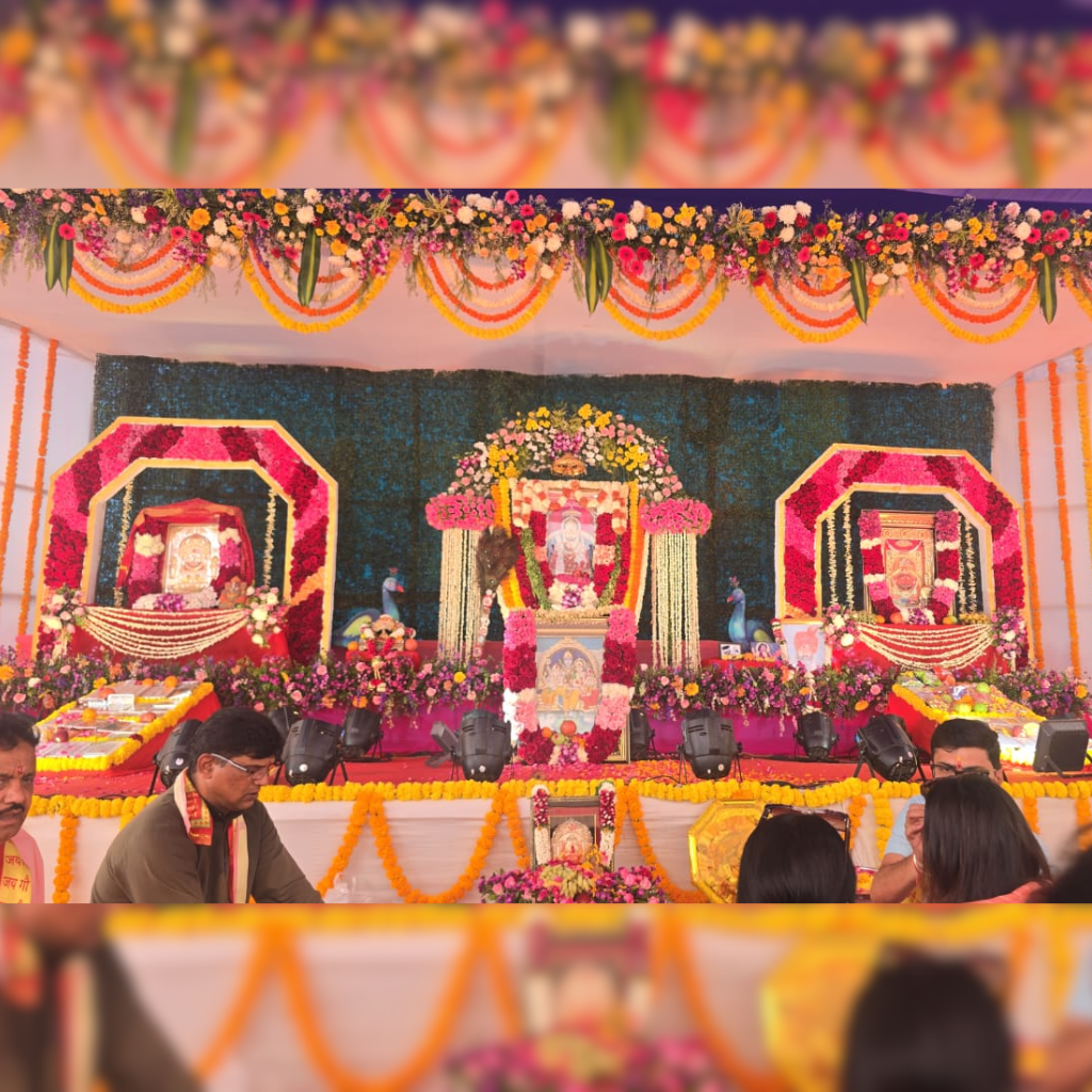 Beautifully decorated stage setup for Shree Narayani Gosala opening ceremony with flowers and spiritual idols